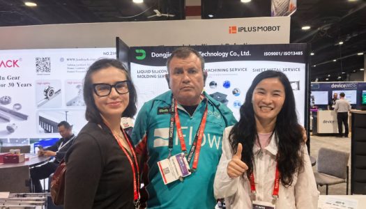 DJME representatives with a visitor at IMTS 2026 in Chicago